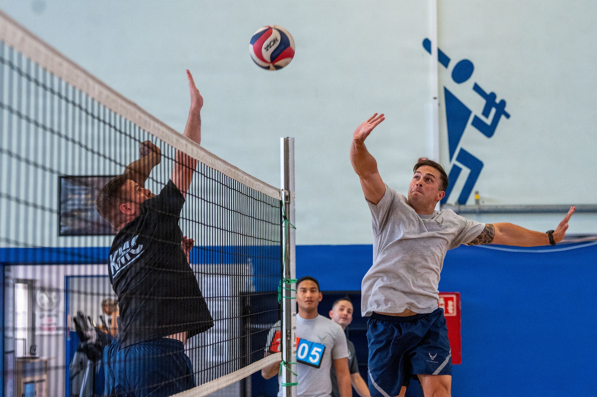 U.S. Air Force Senior Airman Daniel Lance, 86th Operations Support Squadron Survival, Evasion, Resistance and Escape specialist, goes up for a block during a volleyball match.