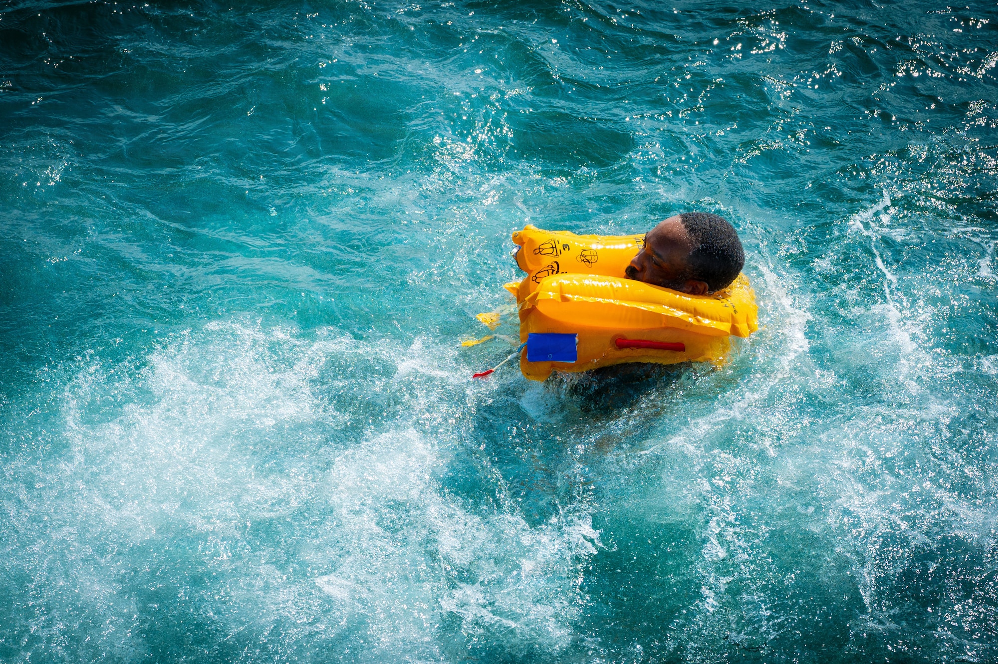 U.S. Air Force Master Sgt. Travis McGarrell, 435th Training Squadron tanker instructor, swims during survival, evasion, resistance, and escape training at Caister-on-Sea, England, July 23, 2026.
