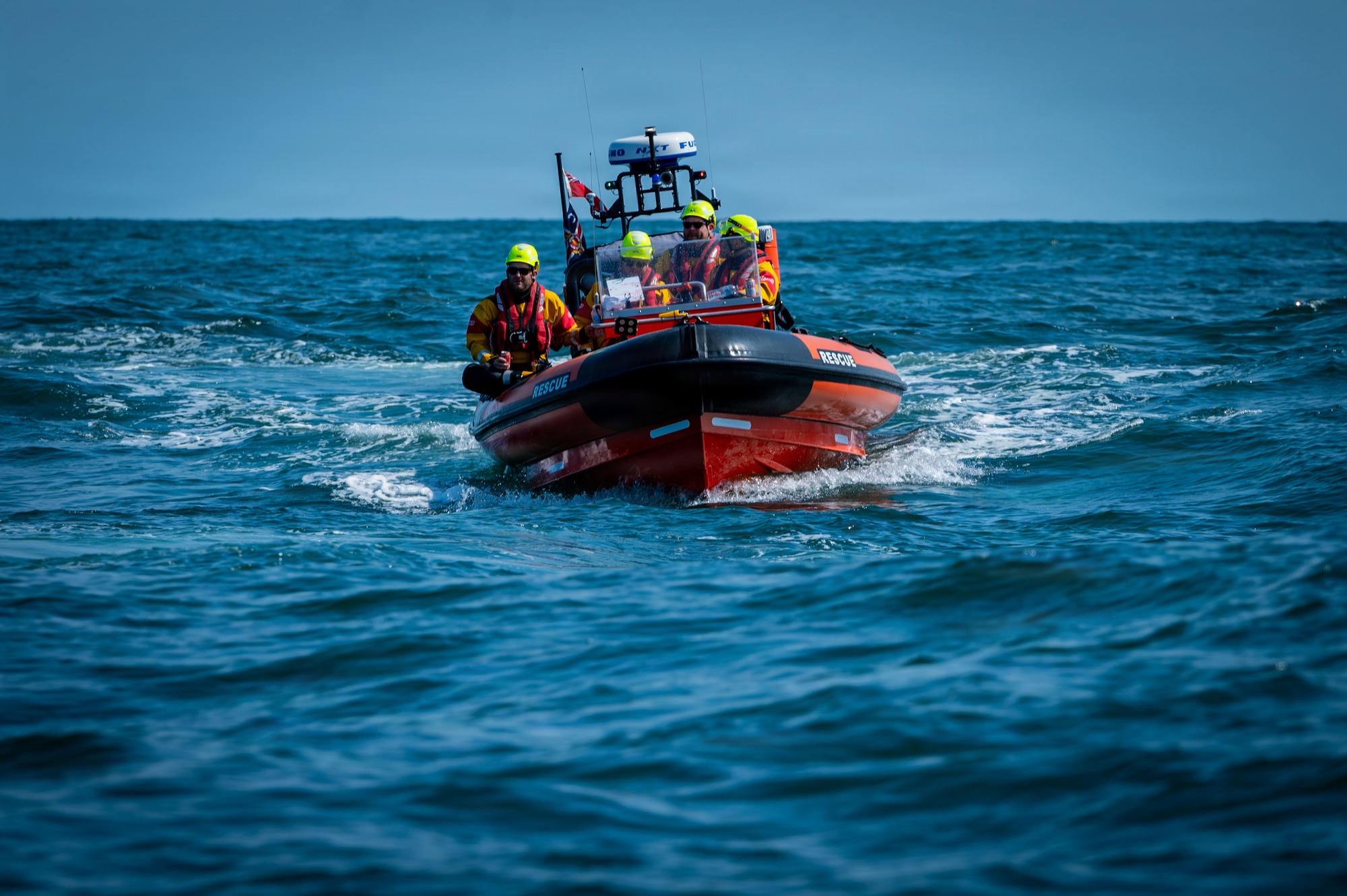 Caister Lifeboat Volunteer Service crew members participate in a joint survival, evasion, resistance, and escape training with U.S. Airmen at Caister-on-Sea, England, July 23, 2026.