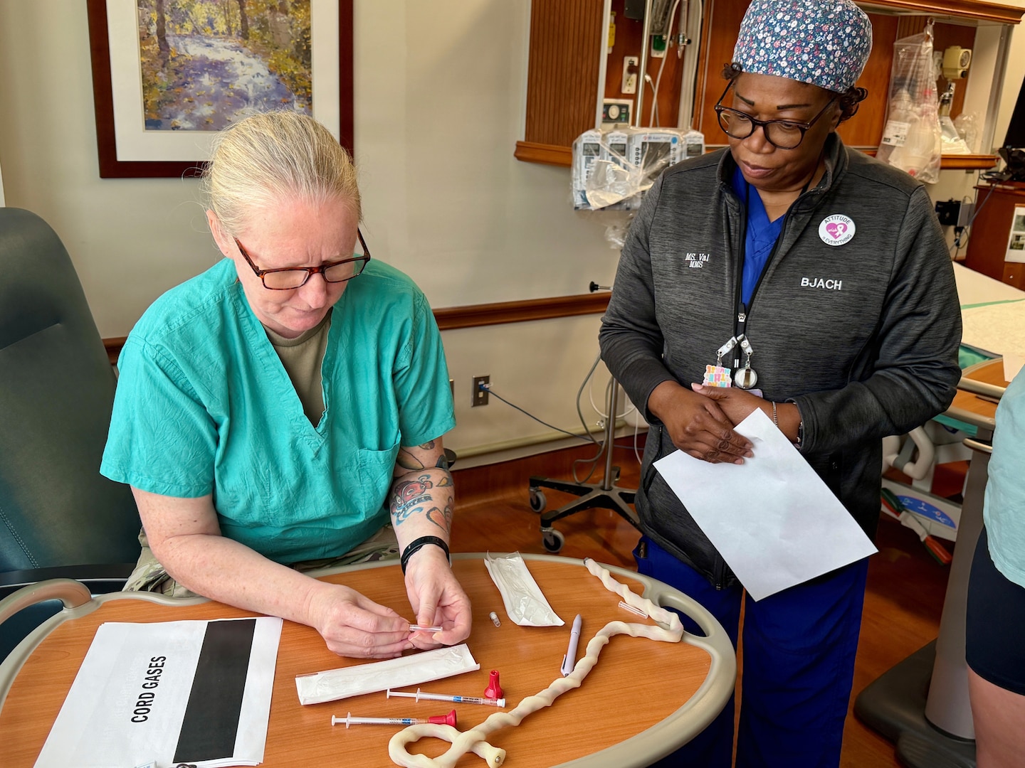 An instructor teaches umbilical cord blood gas collection techniques during the LDRP Skills Fair.