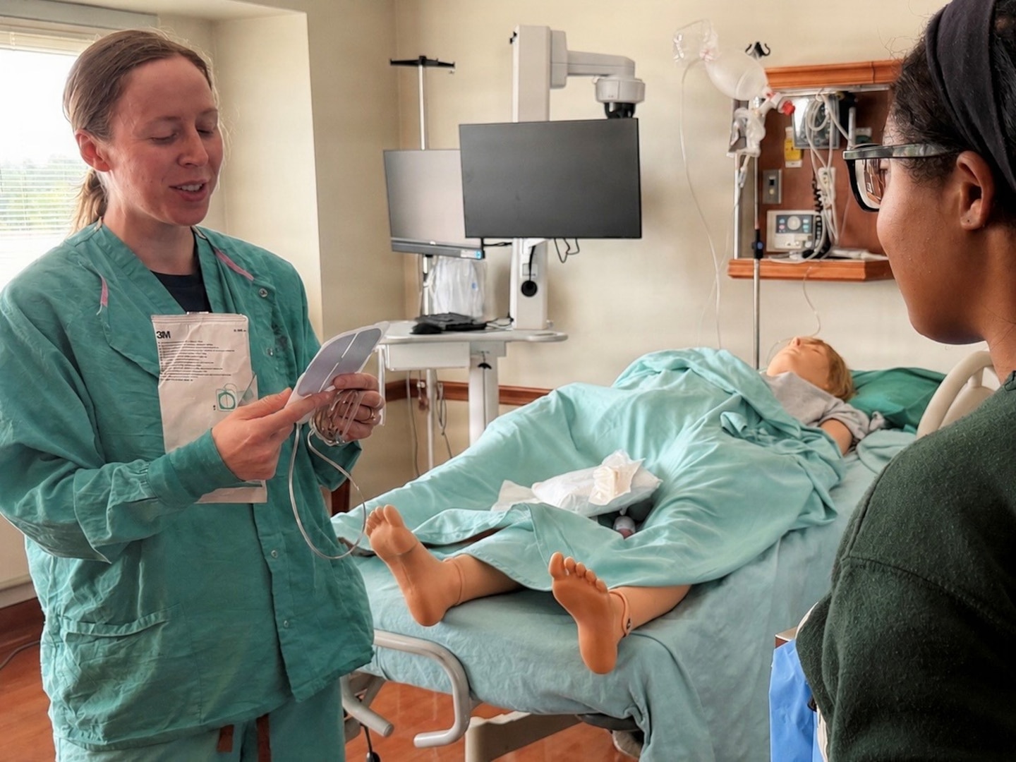 A nurse teaches about opening C-sections during the LDRP Skills Fair.