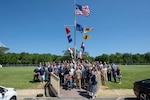 U.S. Naval Research Laboratory (NRL) personnel, family and alumni gather for a group photo outside Blossom Point Tracking Facility (BPTF), commemorating the facility’s 70th anniversary in Welcome, Md., July 30, 2026. (U.S. Navy Photo by Sarah Peterson)