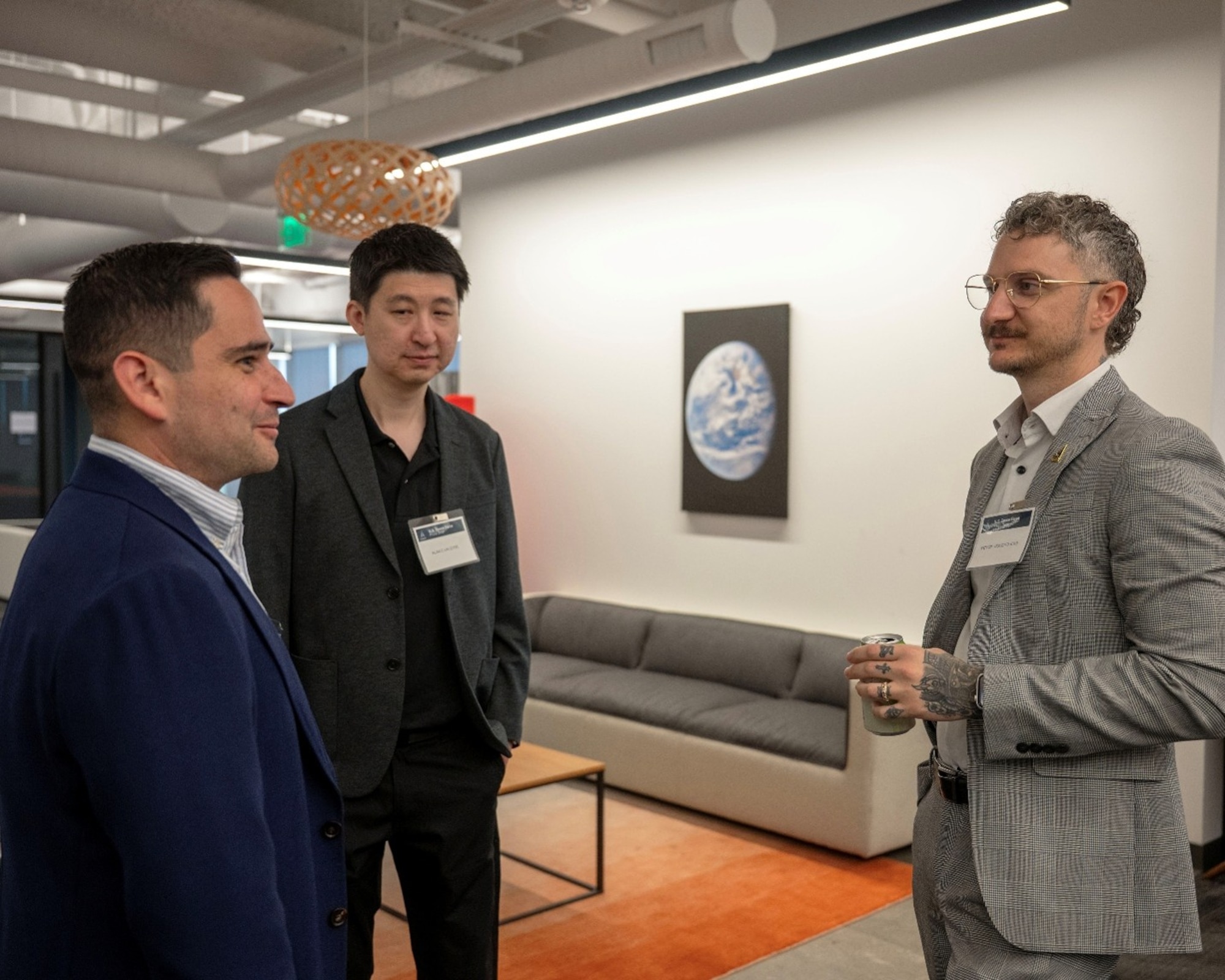 (Left to right) Aaron Parra, director of Space Systems Command’s Small Business Office; Alan Lin, USSF Front Door consigliere; and director, Vic Vigliotti chat during the first-ever USSF Front Door Morning Mixer July 22, 2026 in El Segundo. The Space Force Front Door is a digital platform designed to facilitate collaboration between the USSF, government agencies and the commercial space industry. (USSF photo by Jason Slawson)