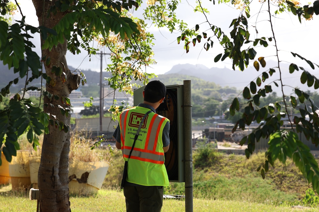 U.S. Army Engineering and Support Center, Huntsville engineer inspects an outdoor electrical control box for installation barriers at a military installation on the island of Oahu, Hawaii, May 13, 2026.