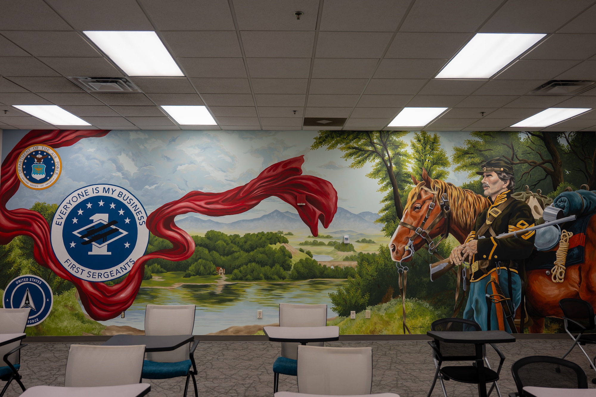 A completed mural is displayed in the First Sergeant Council room, known as the "Diamond Den," at Wright-Patterson Air Force Base, Ohio, June 25, 2026. Staff Sgt. Sara Hallstein, Intelligence Support Squadron noncommissioned officer in charge, dedicated over 100 hours of her personal time to create the artwork, aiming to inspire fellow service members and highlight the importance of creative outlets. (U.S. Air Force photo by Staff Sgt. Kristof J. Rixmann)