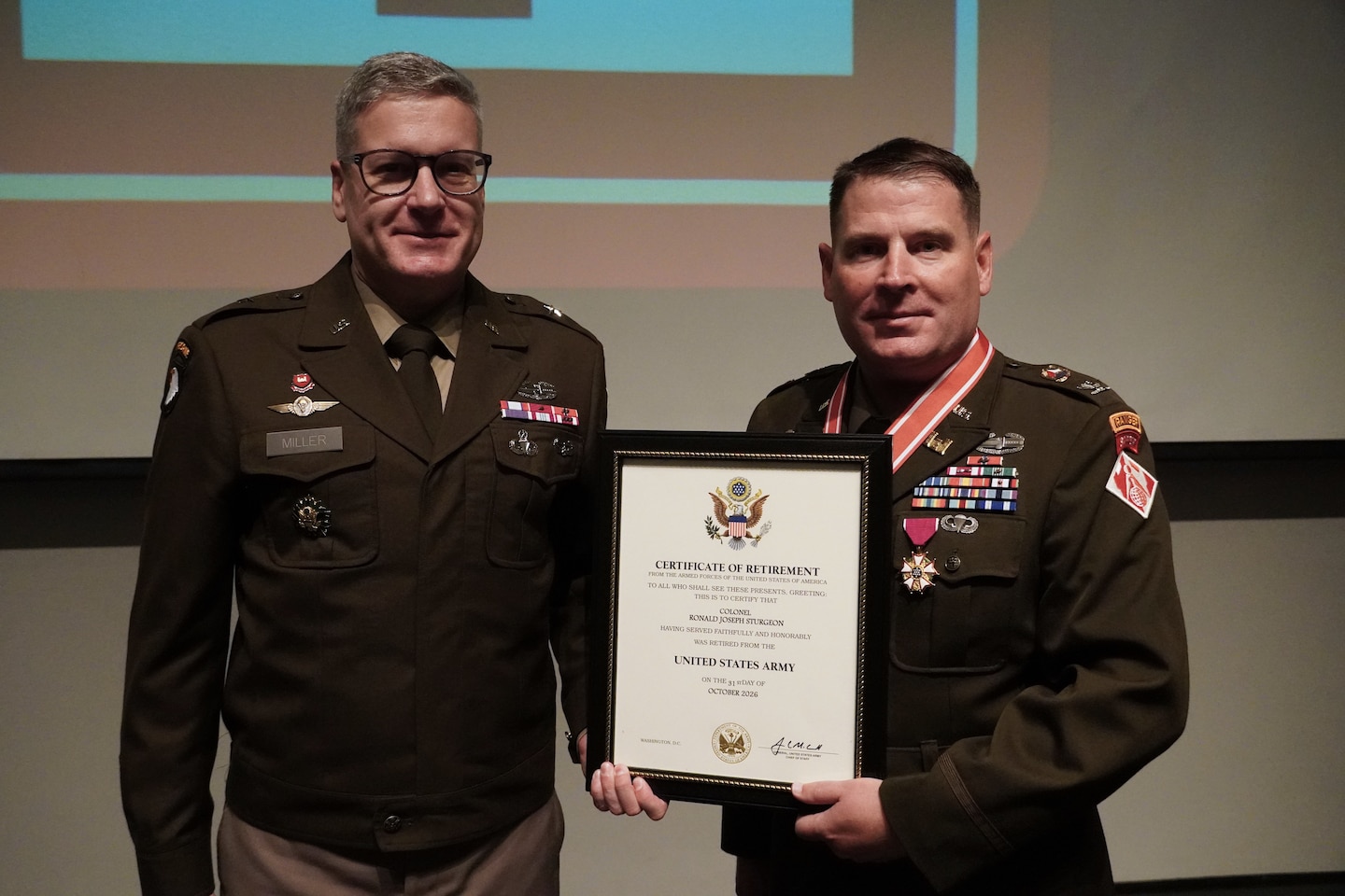 Brig. Gen. Zachary Miller (left) presents Col. Ronald Sturgeon with his retirement certificate during a Change of Command and retirement ceremony for the U.S. Army Corps of Engineers, Savannah District, July 31 in Savannah, Georgia.