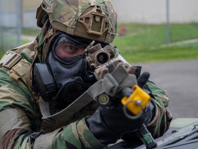 A U.S. Air Force Airman assigned to the 8th Fighter Wing takes a defensive position during an opposing-force training scenario for Beverly Sentinel 26-4 at Kunsan Air Base, South Korea, July 22, 2026. The realistic training required personnel to adapt to complex challenges and strengthened their ability to execute the mission under high-stress conditions. (U.S. Air Force photo by Senior Airman Tabatha Chapman)