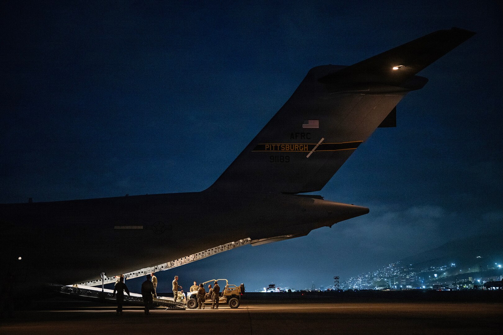 U.S. Air Force Airmen prepare to transport U.S. Marines and equipment aboard a C-17 Globemaster III before departing Simón Bolívar International Airport at Maiquetía, Venezuela, July 16, 2026. At the direction of U.S. Southern Command, the military is supporting State Department-led U.S. disaster assistance for the people of Venezuela following the June 24 earthquakes. (U.S. Air Force photo by Tech. Sgt. Devin M. Rumbaugh)