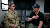 Senior Airman Michelle Ferrari, a 49th Wing public affairs specialist, interviews actor and humanitarian Gary Sinise during his visit to Holloman Air Force Base, N.M., July 12, 2026. Sinise discussed his support for the military community through the Gary Sinise Foundation and Lt. Dan Band performances, which honor service members, veterans, first responders and their families. (U.S. Air Force photo by Airman 1st Class Ariana Barreto)