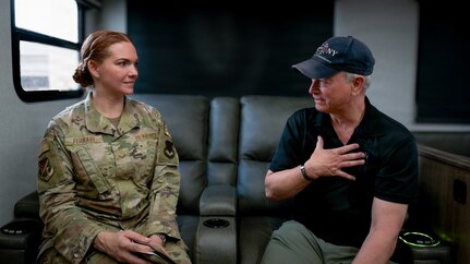 Senior Airman Michelle Ferrari, a 49th Wing public affairs specialist, interviews actor and humanitarian Gary Sinise during his visit to Holloman Air Force Base, N.M., July 12, 2026. Sinise discussed his support for the military community through the Gary Sinise Foundation and Lt. Dan Band performances, which honor service members, veterans, first responders and their families. (U.S. Air Force photo by Airman 1st Class Ariana Barreto)