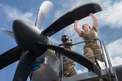 U.S. Air Force Senior Airman Malcom Dixon and Staff Sgt. Reynold Lewis, 86th Aircraft Maintenance Squadron aerospace propulsion journeymen, retorque propeller nuts on a C-130J Super Hercules engine at Ramstein Air Base, Germany, July 17, 2026. Routine engine maintenance helps keep C-130Js mission ready for tactical airlift operations across U.S. Air Forces in Europe-Air Forces Africa. (U.S. Air Force photo by Senior Airman Edgar Grimaldo)
