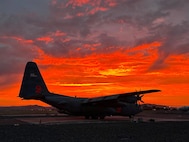 A C-130H Hercules from the 302nd Airlift Wing, call sign MAFFS 2, sits on the flightline at sunset at Klamath Falls, Ore., July 22, 2026. The aircraft is equipped with a U.S. Forest Service-owned Modular Airborne Fire Fighting System and supports aerial firefighting missions across the West Coast, augmenting the civilian air tanker fleet when commercial resources are fully committed. (U.S. Air Force courtesy photo)