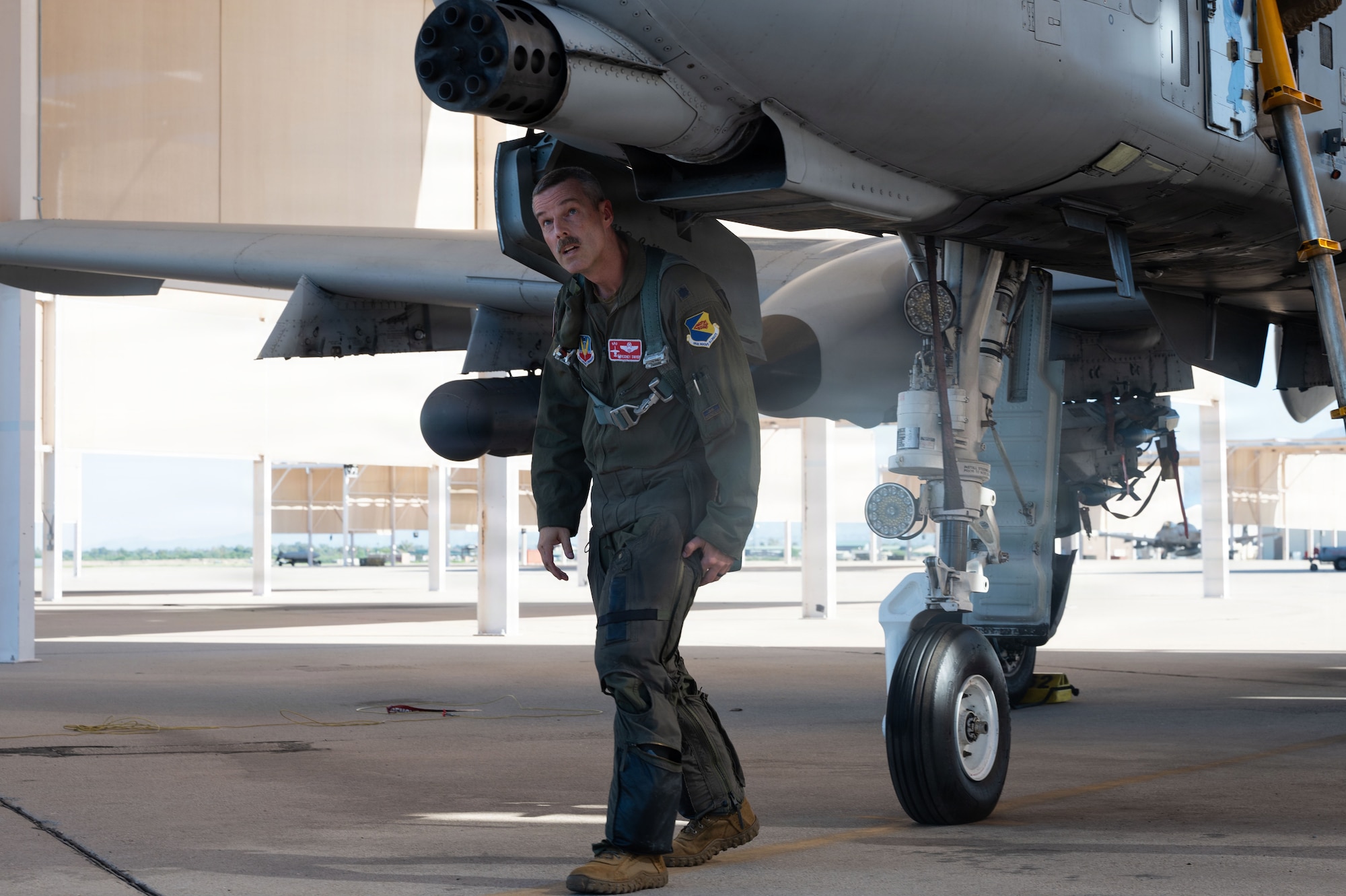 U.S. Air Force Lt. Col. Rodney Dwyer, 355th Operations Group commander, performs pre-flight checks on the A-10C Thunderbolt II before his final flight at Davis-Monthan Air Force Base, Arizona, July 29, 2026. From Operation Desert Storm to Inherent Resolve, the A-10s of Davis-Monthan have a decorated combat history. (U.S. Air Force photo by Airman Najzee Kuzu)