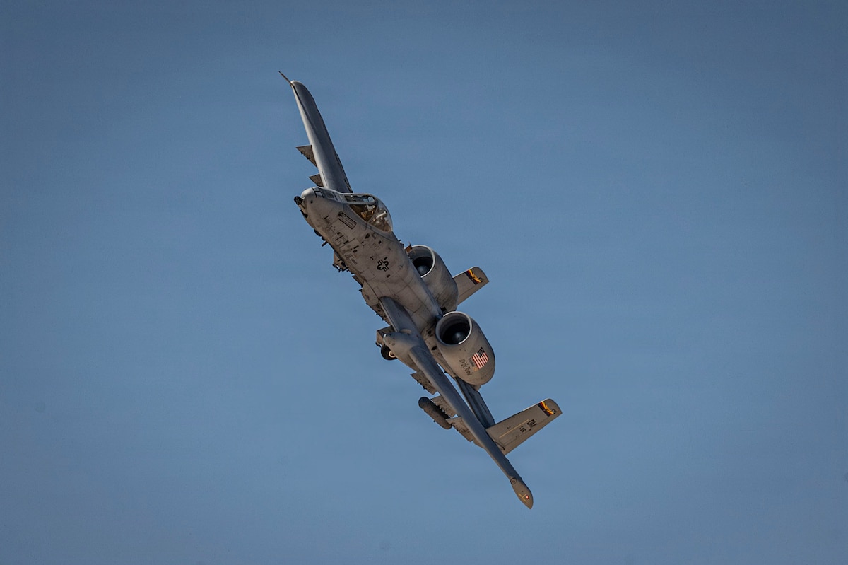 A U.S. Air Force A-10C Thunderbolt II aircraft on its final flight, flies over Davis-Monthan Air Force Base, Arizona, July 29, 2026. The aircraft has supported close air support missions for decades and remains a symbol of combat airpower at Davis-Monthan. (U.S. Air Force photo by Airman 1st Class Samantha Melecio)