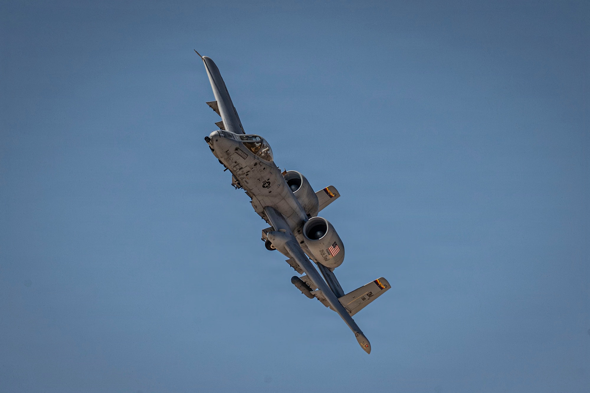 A U.S. Air Force A-10C Thunderbolt II aircraft on its final flight, flies over Davis-Monthan Air Force Base, Arizona, July 29, 2026. The aircraft has supported close air support missions for decades and remains a symbol of combat airpower at Davis-Monthan. (U.S. Air Force photo by Airman 1st Class Samantha Melecio)