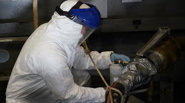 JOINT BASE PEARL HARBOR-HICKAM, Hawaii (June 26, 2026) Arturo Barrientos Montano of Naval Sea Systems Command retrieves a wastewater sample aboard Wasp-class amphibious assault ship USS Essex (LHD 2). This research study is in collaboration with Bureau of Medicine and Surgery, Naval Health Research Center, and Naval Surface Warfare Center during Rim of the Pacific (RIMPAC) exercise 2026. Thirty-one nations, 36 surface ships, 5 submarines, 15 national land forces, more than 206 aircraft and 25,000 personnel are participating in RIMPAC in and around the Hawaiian Islands, June 24 to July 31. The world's largest international maritime exercise, RIMPAC provides a unique training opportunity while fostering and sustaining cooperative relationships among participants critical to ensuring the safety of sea lanes and security on the world's oceans. RIMPAC 26 is the 30th exercise in the series that began in 1971. (U.S. Navy photo by Danielle Cazarez/Released)