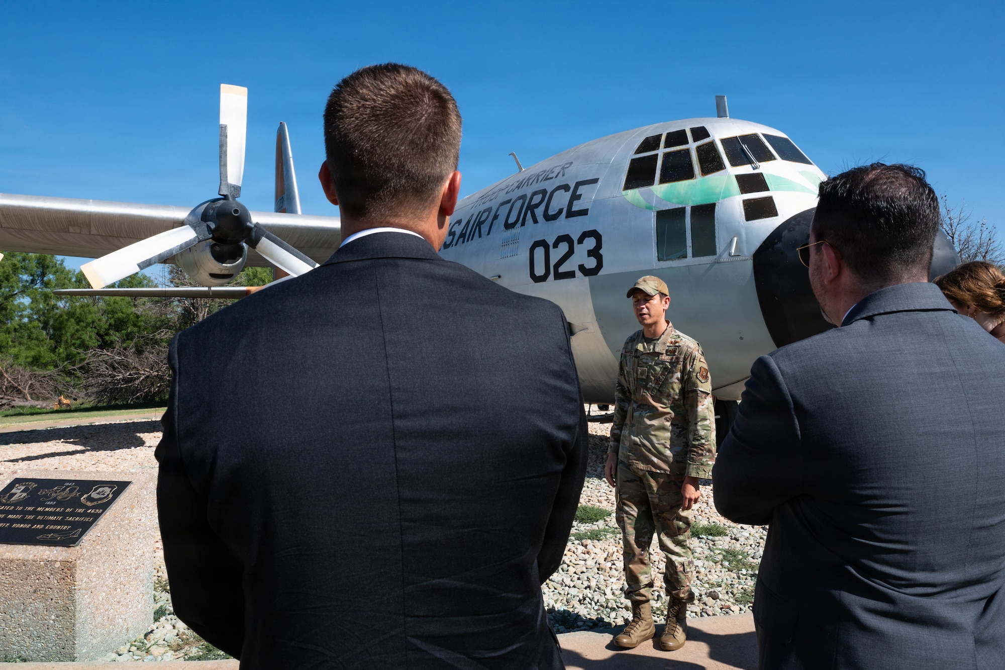 Airman brief civilians on C-130s.