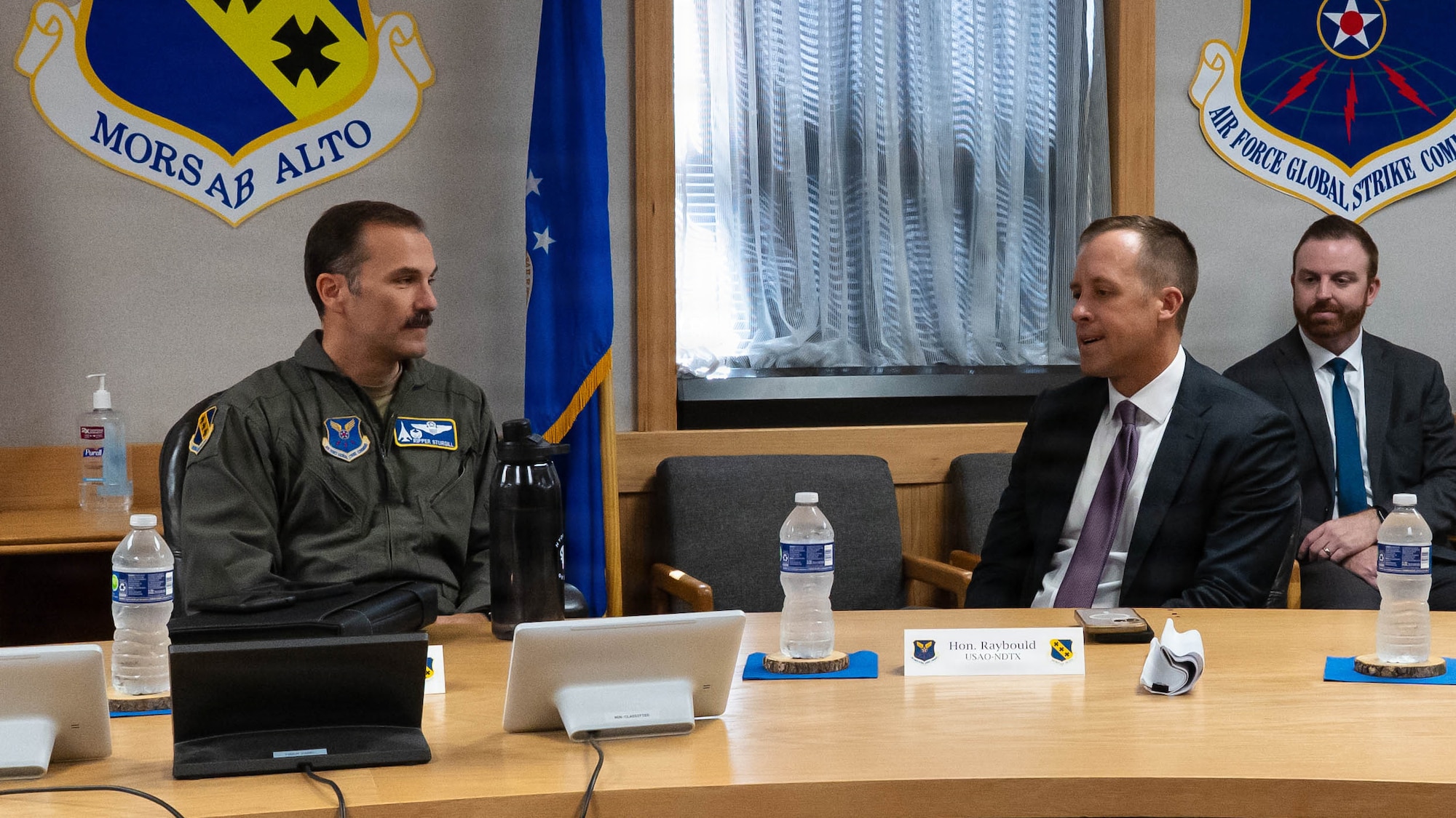 Wing commander talks with U.S. Attorney.