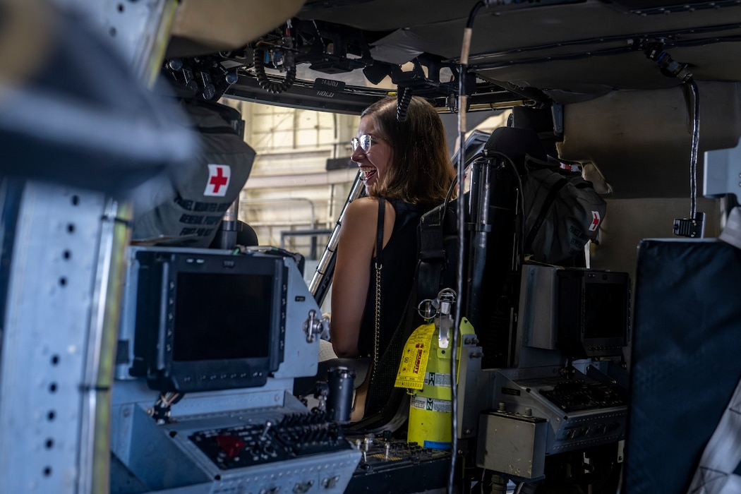 Lady sitting in military air craft