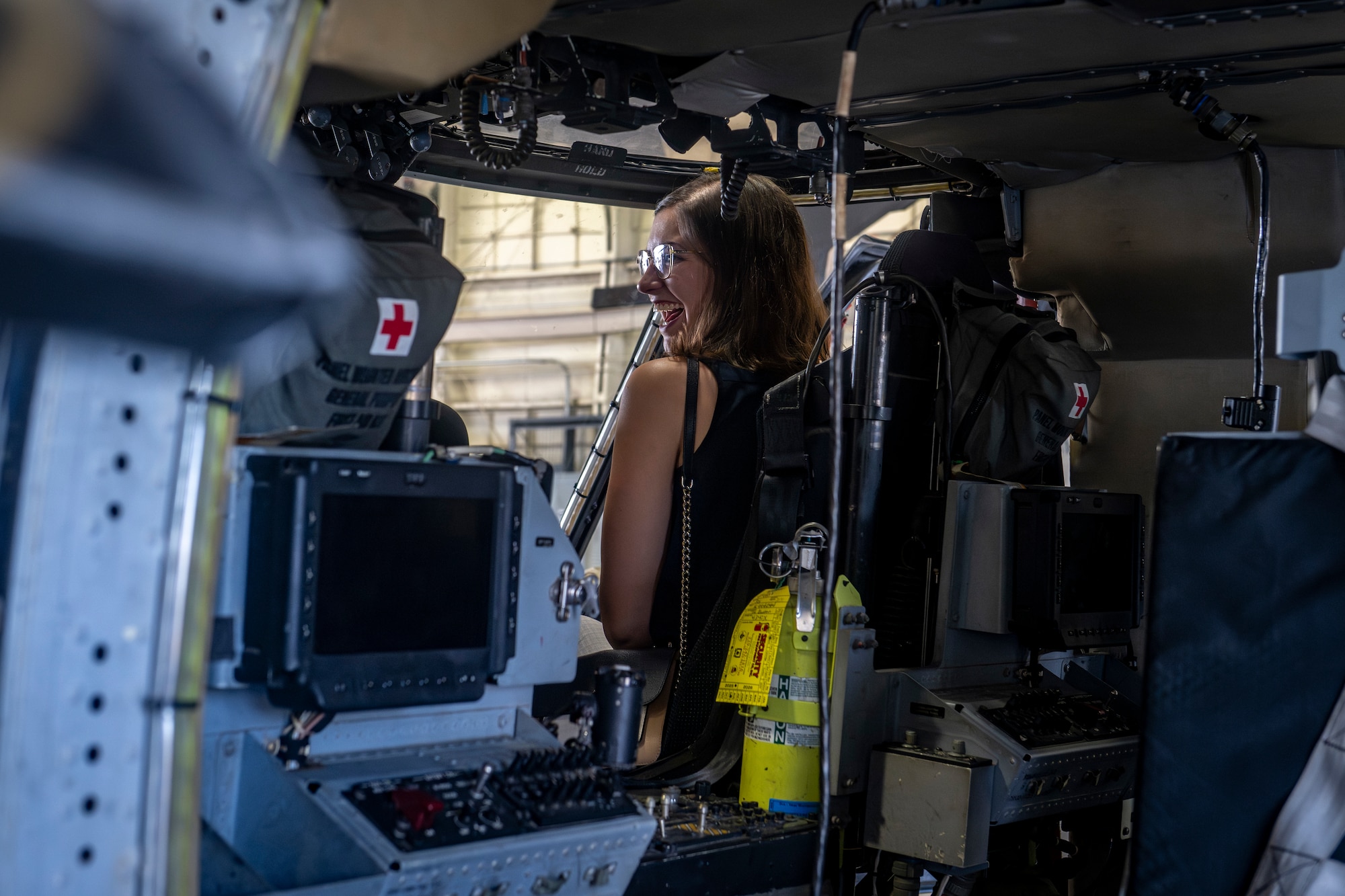 Lady sitting in military air craft