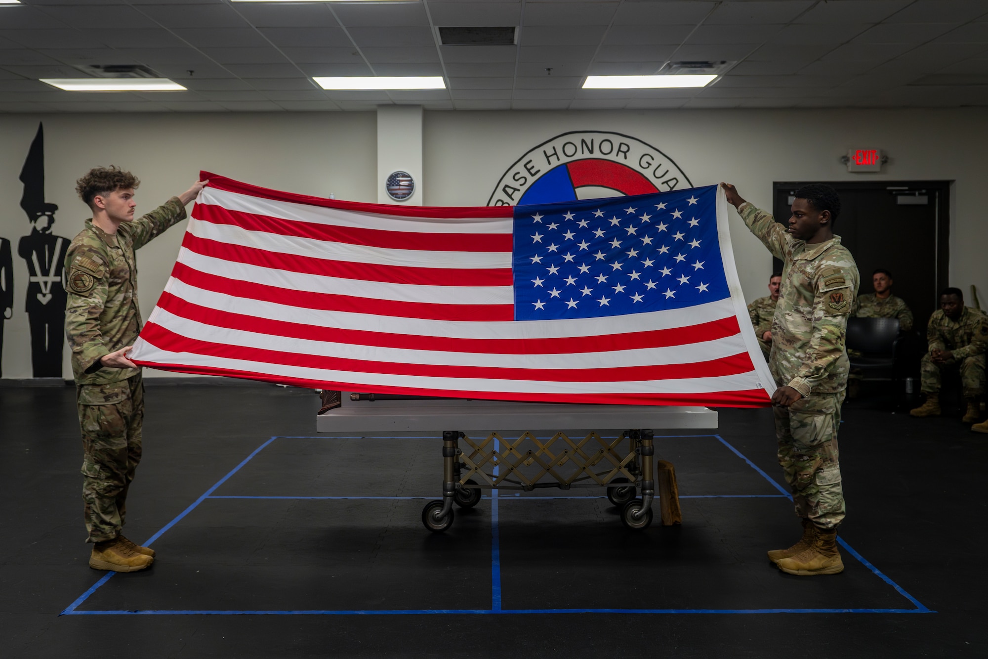 2 people holding a flag