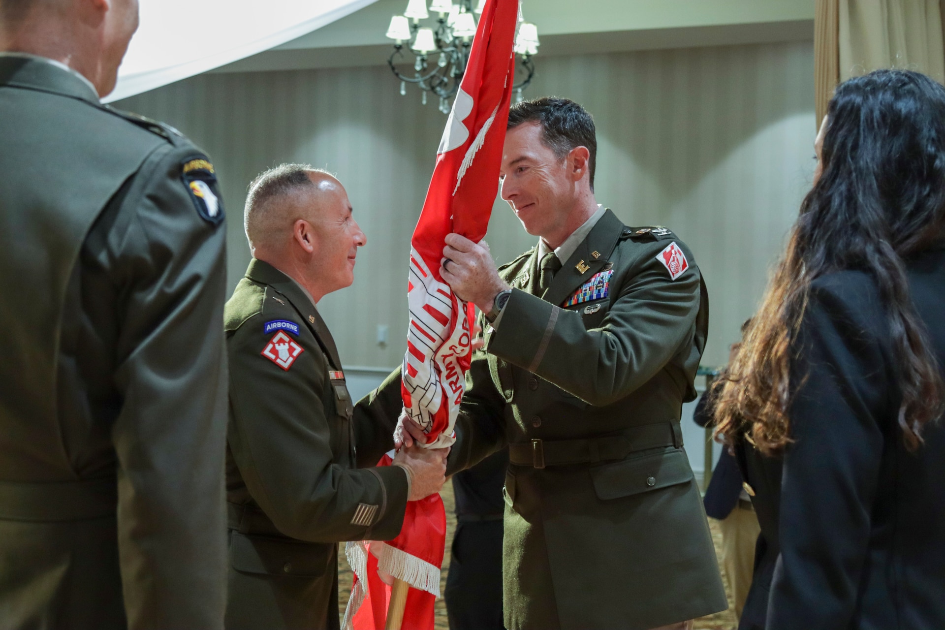 Col. Joshua Bost, right, incoming U.S. Army Corps of Engineers Los Angeles District commander, receives the USACE colors from Brig. Gen. John Lloyd, U.S. Army Corps of Engineers South Pacific Division commander and division engineer July 31 in the Fort MacArthur Community Center in San Pedro, California. The passing of the colors in a military change of command ceremony symbolizes the transfer of authority, responsibility and the unit’s enduring history from an outgoing commander to an incoming commander.