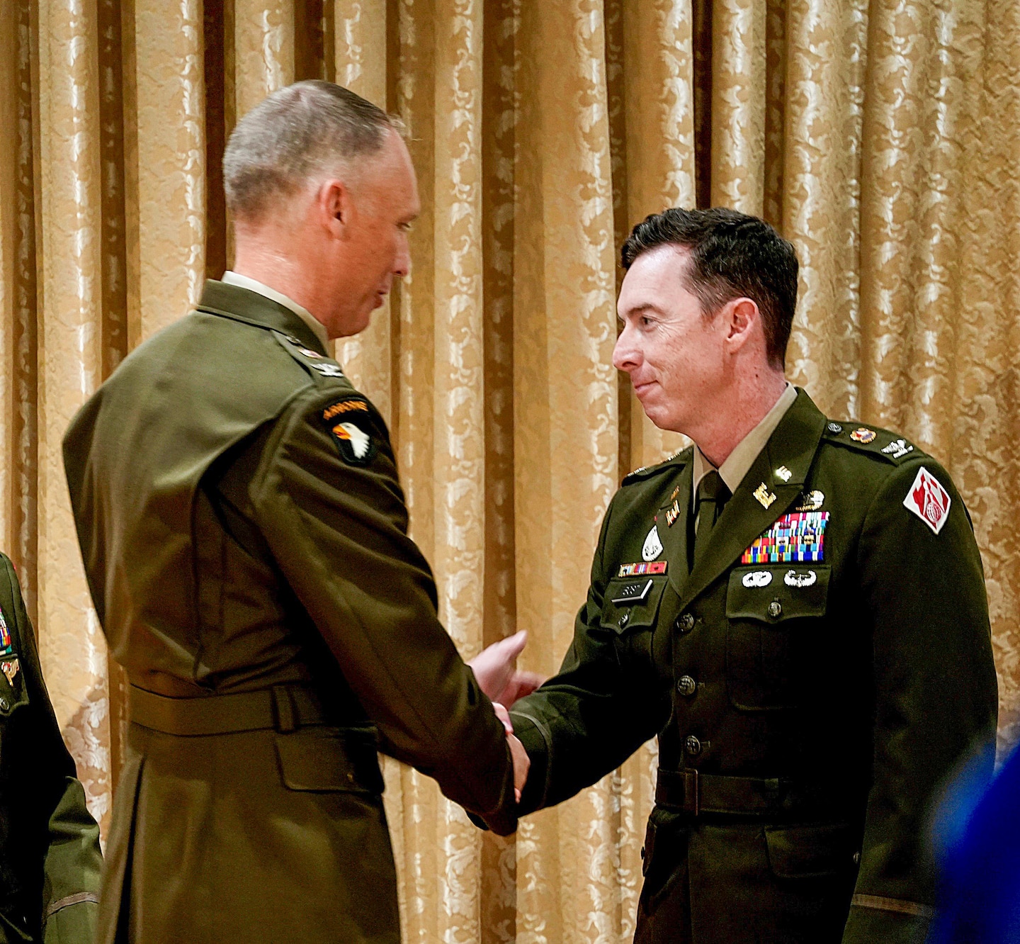 Col. Andrew Baker, left, outgoing commander of the U.S. Army Corps of Engineers Los Angeles District, shakes hands with Col. Joshua Bost, incoming commander, during a change of command ceremony July 31 at Fort MacArthur in San Pedro, California. Baker relinquished command to Bost after leading the LA District since July 2023.