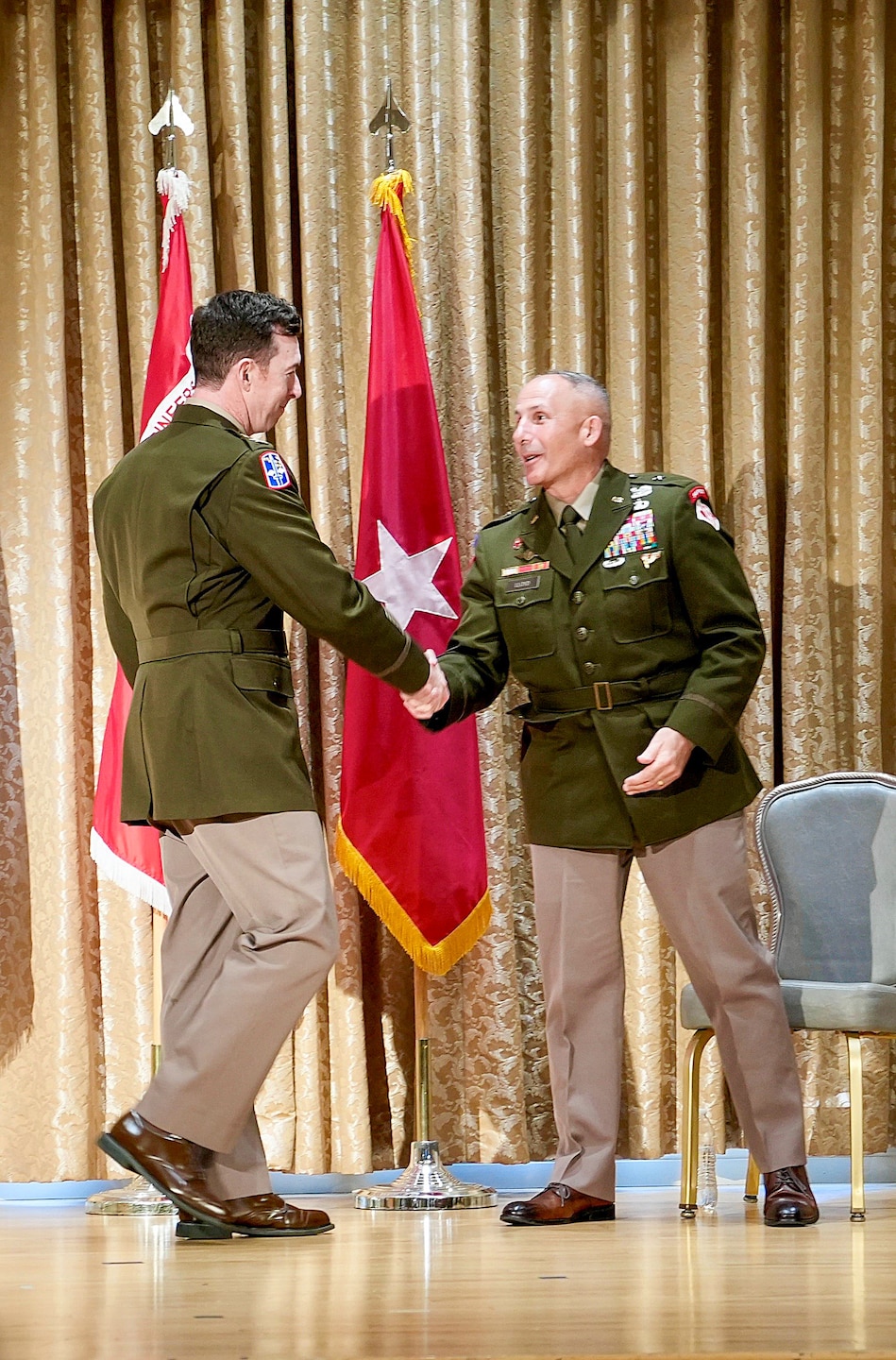 Col. Joshua Bost, left, incoming commander of the U.S. Army Corps of Engineers Los Angeles District, shakes hands with Brig. Gen. John Lloyd, South Pacific Division commander, after delivering remarks during a change of command ceremony July 31 at Fort MacArthur in San Pedro, California. Lloyd served as the presiding officer for the transition ceremony.