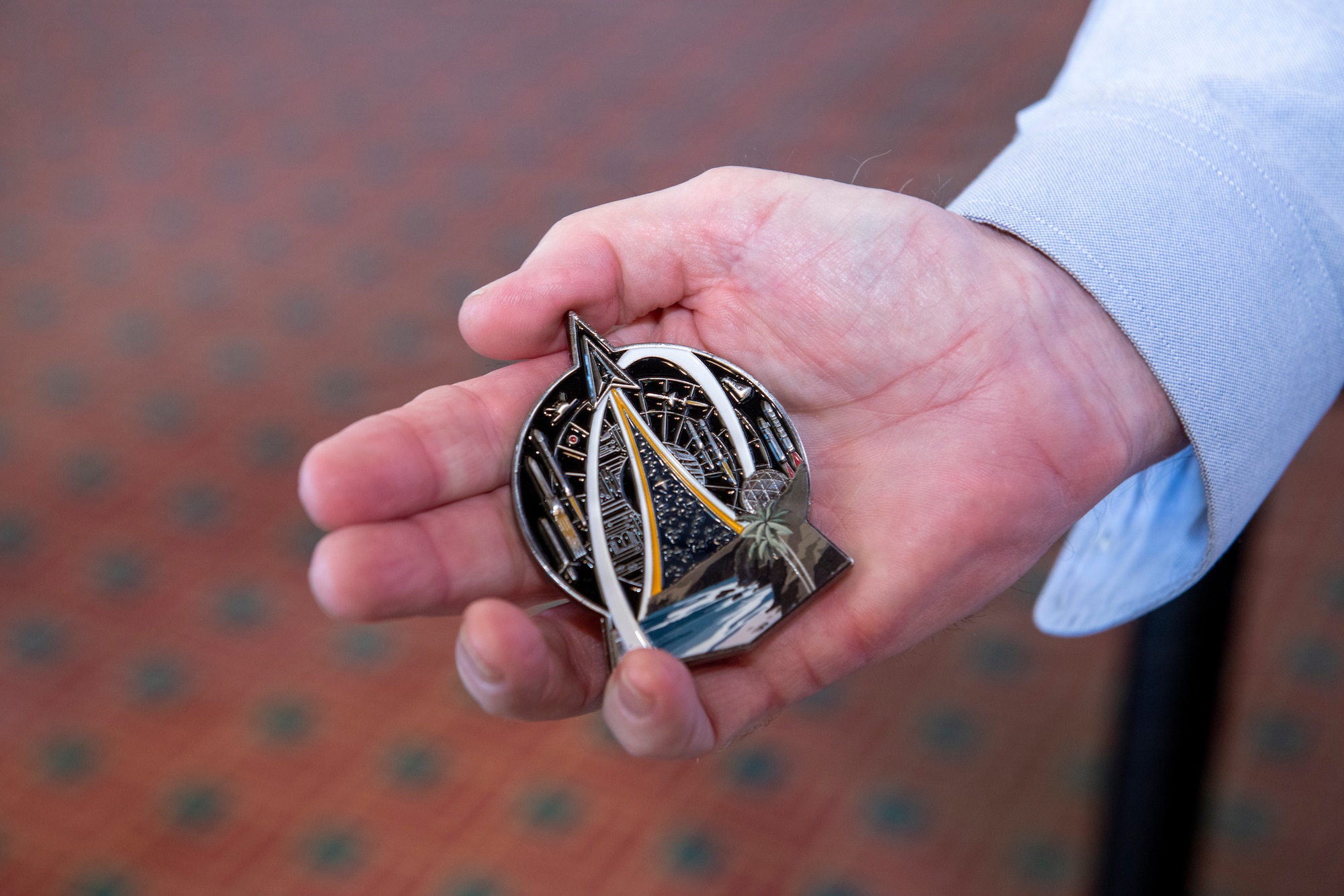 A hand holds and object