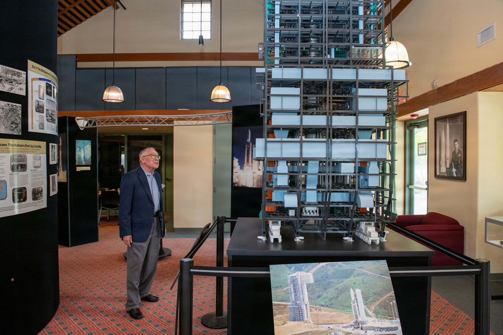 A person stands and looks at an object