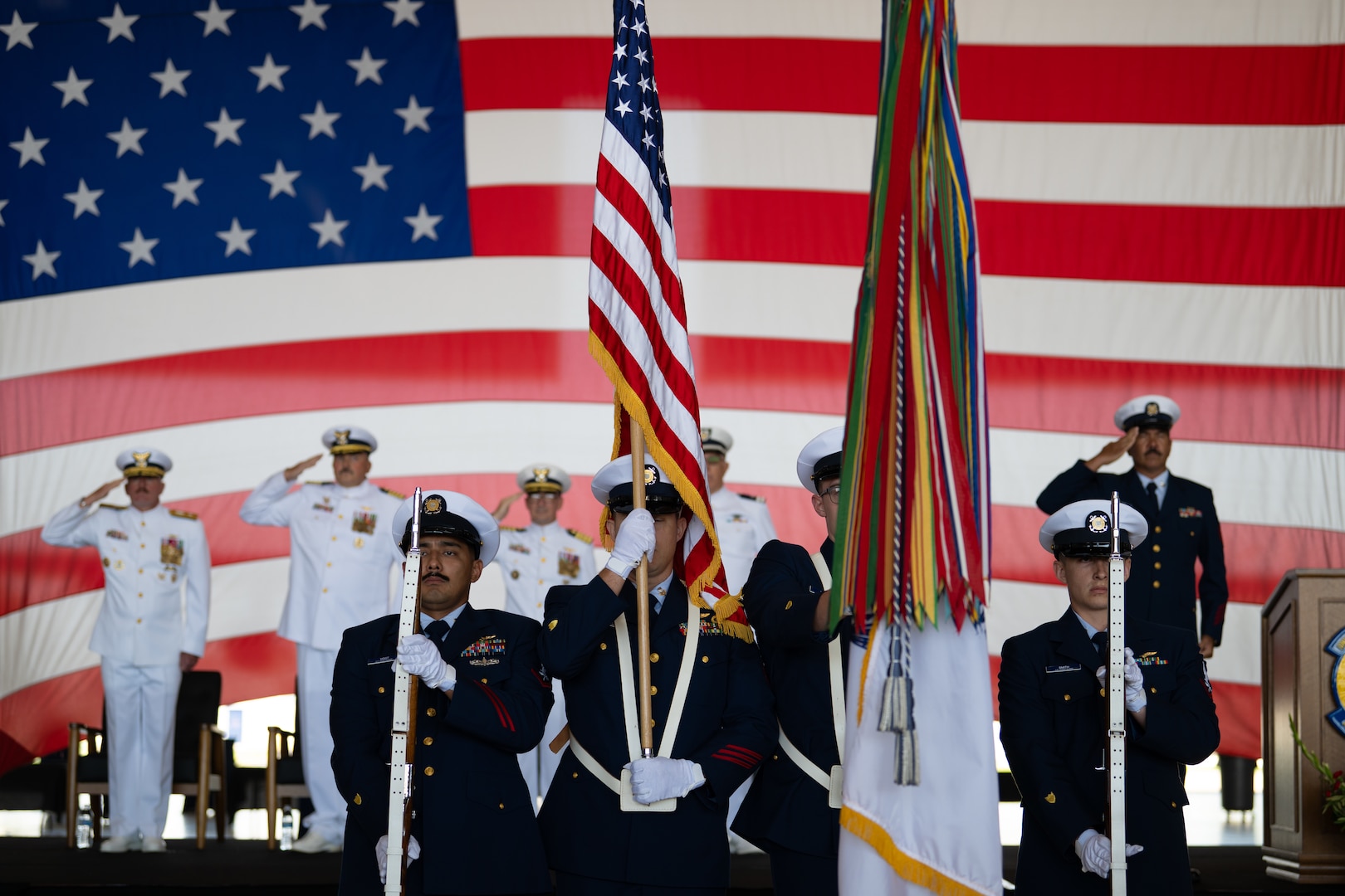 U.S. Coast Guard color guard members present colors during a change of command ceremony at Coast Guard Air Station Sacramento, McClellan Park, California, July 31, 2026. During the ceremony, Coast Guard Capt. Patrick Dill was formally recognized as the new air station commander. (U.S. Coast Guard photo by Petty Officer 3rd Class Kenneth Wiese)