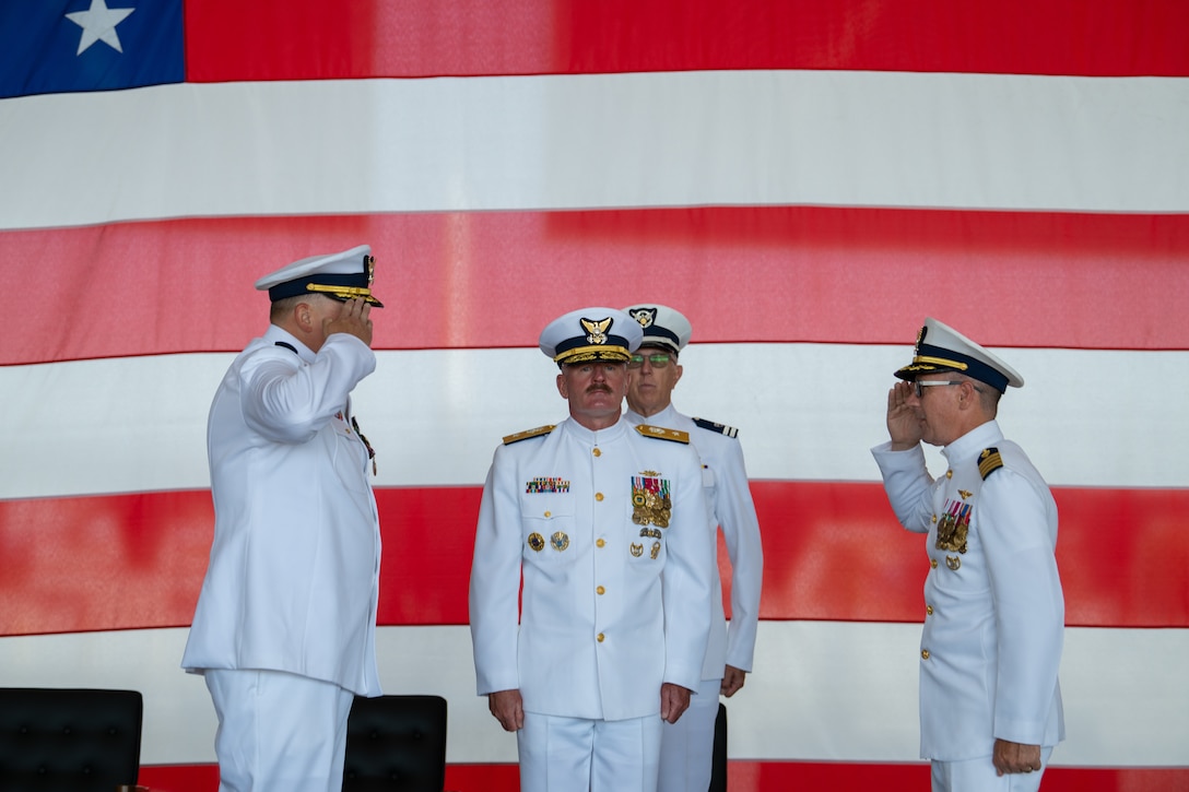U.S. Coast Guard Capt. Bradford Apitz and Capt. Patrick Dill render a salute during a change of command ceremony at Air Station Sacramento, McClellan Park, California, July 31, 2026. During the ceremony, Dill was formally recognized as the new air station commander. (U.S. Coast Guard photo by Petty Officer 3rd Class Kenneth Wiese)