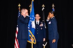 U.S. Air Force Col. Lacresha A. Merkle (right) renders her first salute to Brig. Gen. Jeffrey W. Nelson (left), outgoing commander of the Air Force Recruiting Service (AFRS), during an assumption of command ceremony at Joint Base San Antonio-Randolph, Texas, July 30, 2026. Chief Master Sgt. Jake Fason (center), the new AFRS command chief, served as the guidon bearer for the ceremony, where Merkle formally took leadership of the service from Nelson. (U.S. Air Force photo by A1C Amanda Yastrzab)