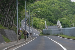 Service members and civilians participate in a Norwegian Foot March at Misawa Air Base (AB), Japan, May 27, 2026.