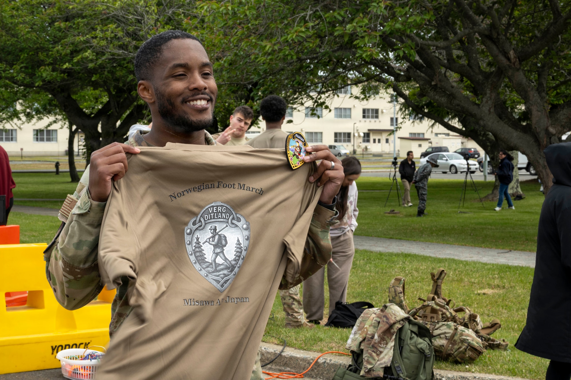 A U.S. Airman holds up a Norwegian Foot March shirt after completing the event at Misawa Air Base (AB), Japan, May 27, 2026.