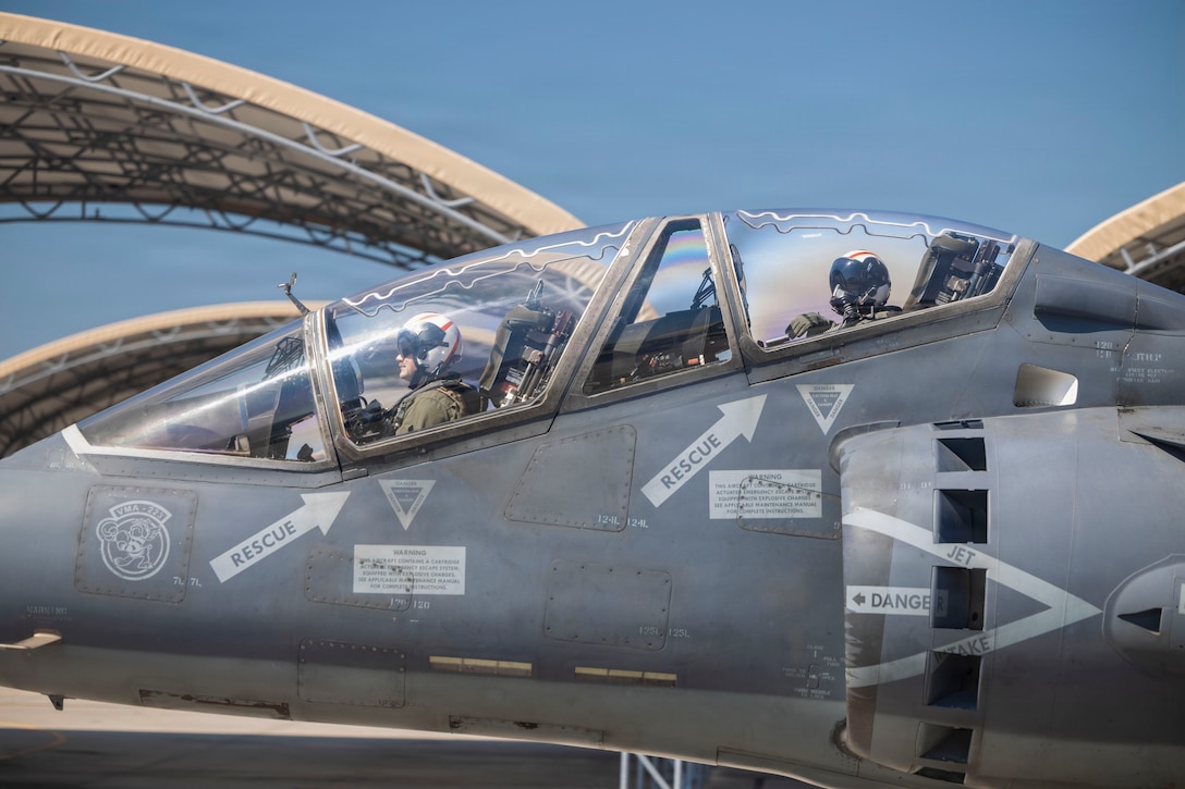 U.S. Marine Corps Maj. Eric Shiebe, left, from Georgia, an AV-8B Harrier pilot and executive officer, takes Sgt. Tatiana Rios, right, from Wisconsin, a fixed wing aircraft airframe mechanic, both with Marine Attack Squadron (VMA) 223, Marine Aircraft Group 14, 2nd Marine Aircraft Wing, in an incentive flight on board of a TAV-8B Harrier II at Marine Corps Air Station Cherry Point, North Carolina, May 19, 2026. Incentive flights provide an opportunity for Marines within the squadron to ride in the back of a TAV-8B Harrier II as a reward for exceptional job performance. (U.S. Marine Corps photo by Lance Cpl. Bryan Giraldo)