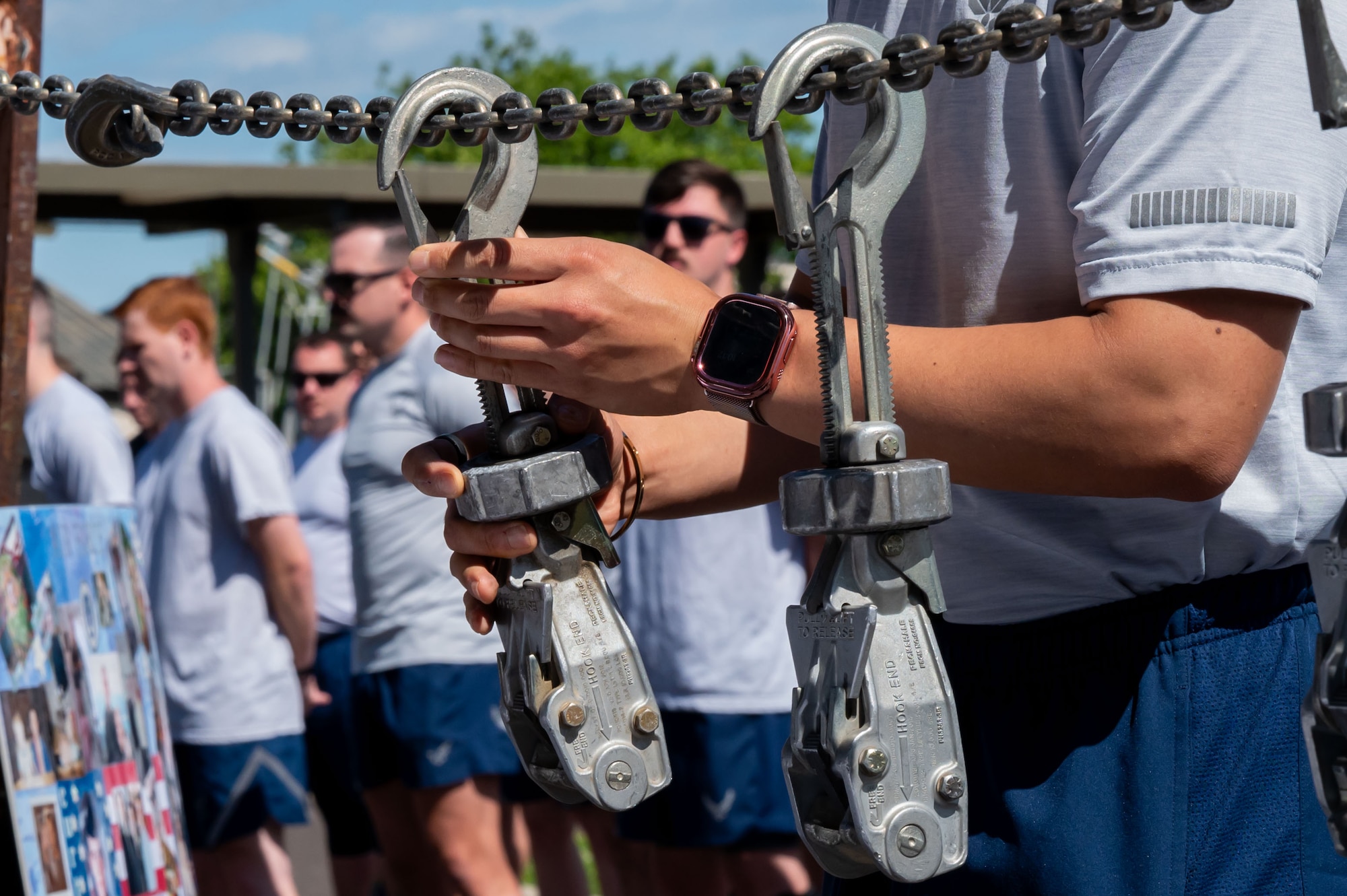 A U.S. Air Force Airman adds a device to a chain during a ceremony before the 13th annual Port Dawg memorial run at Joint Base McGuire-Dix-Lakehurst, N.J., May 28, 2026.