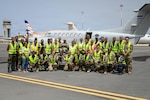 New Hampshire National Guard members, Cabo Verde Armed Forces Medical Unit members and medical professionals from the Ministry of Health pose for a group photo in front of a C-12 Huron multipurpose aircraft assigned to the Cabo Verde Coast Guard Air Squadron in Praia, Cabo Verde, May 22, 2026. The aeromedical knowledge exchange strengthened professional relationships and improved shared understanding of patient movement planning in a geographically dispersed island environment. Photo by Staff Sgt. Elliot Boutin.