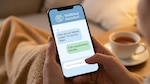Smartphone displaying AI chat application for mental health support, featuring conversation about feelings and emotional well being.
