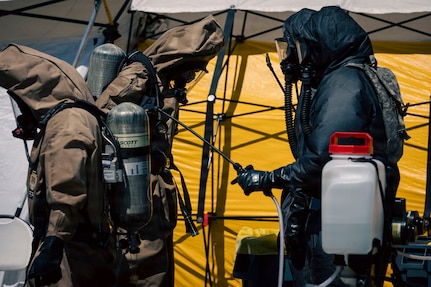 U.S. Soldiers and Airmen with the Washington National Guard’s 10th Homeland Response Force decontaminate search and recovery teams following a chemical tank rupture at the Nippon Dynawave pulp and paper mill in Longview, Washington, May 28, 2026.