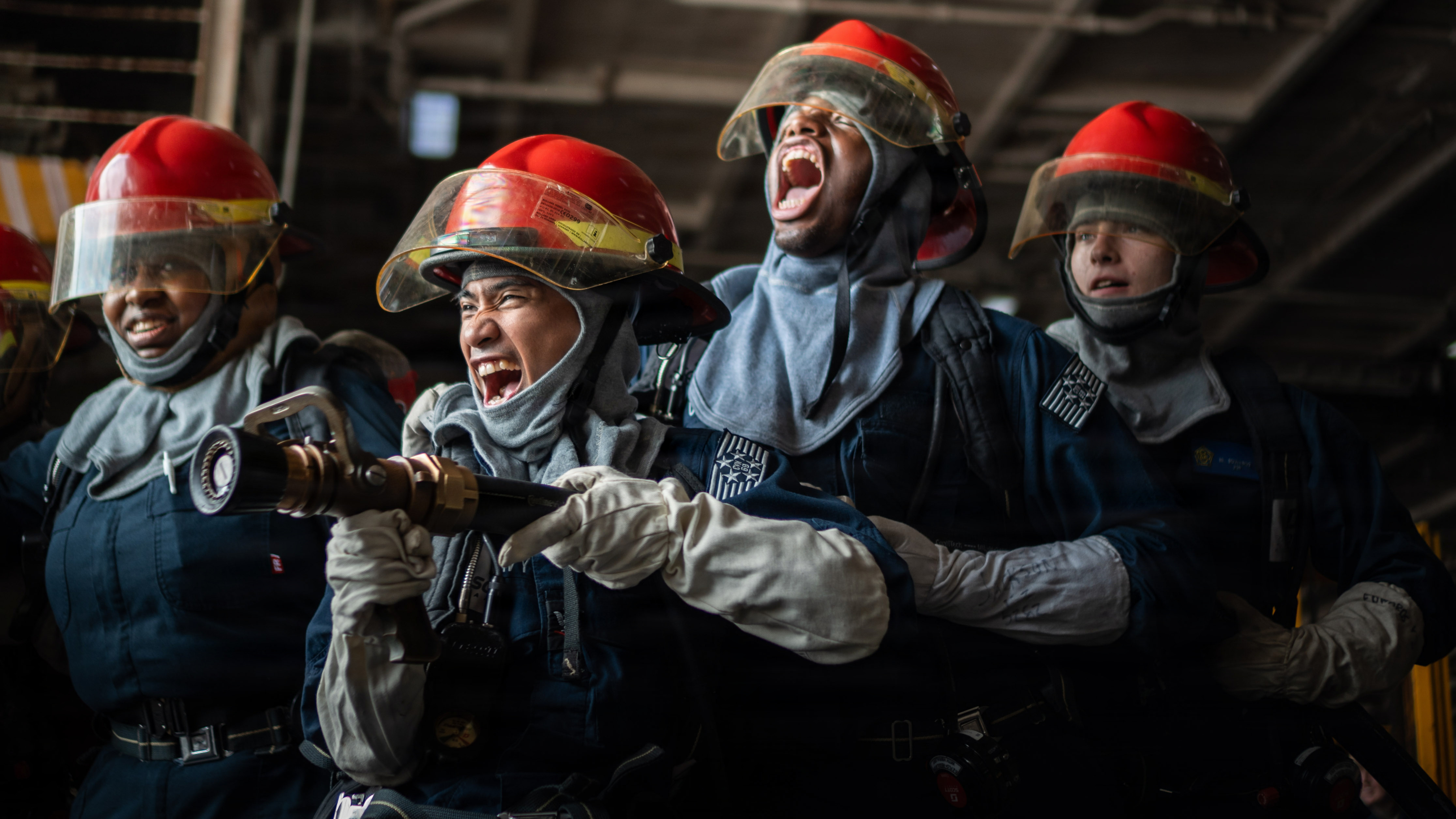 U.S. Navy Sailors simulate fighting a fire during a drill aboard Nimitz-class aircraft carrier USS Dwight D. Eisenhower (CVN 69), May 27, 2026. Eisenhower is pierside at Naval Station Norfolk conducting routine operations. (U.S. Navy photo by Mass Communication Specialist 2nd Class Miguel Santiago)