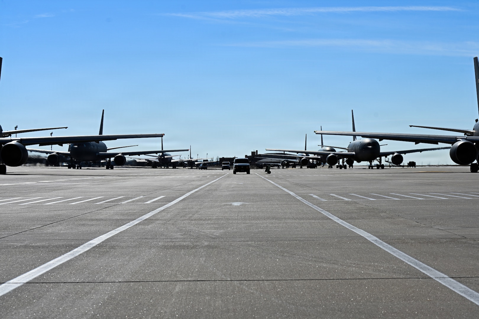 Alert vans arrive at the flightline during a nuclear operational response exercise at McConnell Air Force Base, Kansas, Feb. 7, 2026. Each van had a designated spot in which the members would exit and board an awaiting KC-46 Pegasus. (U.S. Air Force photo by Senior Airman Amelio Brown)