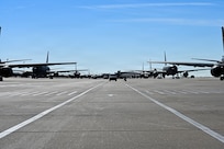 Alert vans arrive at the flightline during a nuclear operational response exercise at McConnell Air Force Base, Kansas, Feb. 7, 2026. Each van had a designated spot in which the members would exit and board an awaiting KC-46 Pegasus. (U.S. Air Force photo by Senior Airman Amelio Brown)