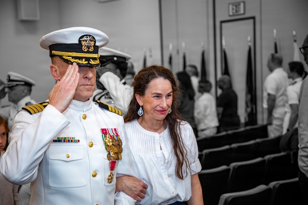 Capt. Chad McKenzie, deputy commander, Naval Medical Forces Atlantic (NMFL) and a native of Bellefontaine, Ohio, goes ashore with his family during his retirement ceremony on board Naval Support Activity (NSA) Hampton Roads - Portsmouth Annex, Portsmouth, Virginia, May 29, 2026. McKenzie served the Navy for nearly 30 years of dedicated service across 16 commands and helped advance Navy Medicine’s operational readiness and expeditionary medical capabilities in support of Fleet, Marine Corps, and joint force requirements. (U.S. Navy photo illustration by Mass Communication Specialist 2nd Class Levi Decker)