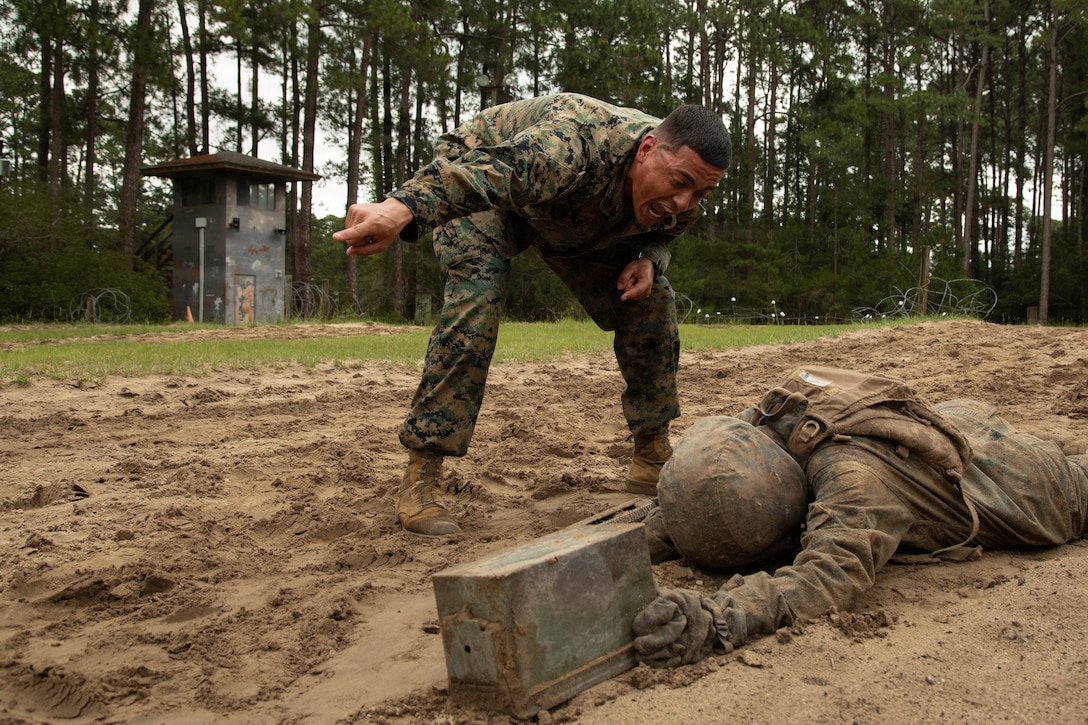 U.S. Marine Corps Staff Sgt. Samuel Restrepo, a Drill Instructor with Delta Company, 1st Recruit Training Battalion, directs a recruit through the Battle of Fallujah event during the Crucible on Marine Corps Recruit Depot, Parris Island, S.C., May 29, 2026 .The crucible is the culminating event that marks the transition from recruit to Marine. (U.S. Marine Corps photo by Lance Cpl. Katherine Fohn)