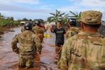 U.S. Soldiers assigned to the Hawaiʻi National Guard Chemical, Biological, Radiological, Nuclear and Explosives Enhanced Response Force Package assist the city and county of Honolulu first responders in search and recovery efforts during flood impacted zones in Waialua, Hawaiʻi, March 21, 2026. Gov. Josh Green activated the Hawaiʻi National Guard to assist in recovery efforts following record rainfall and flash flooding caused by a Kona Low weather system. Photo by Spc. Daniel Barcenas.