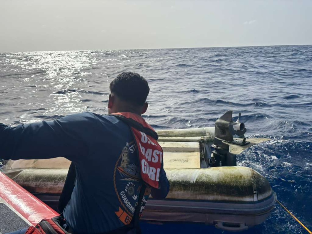A Coast Guard Boat Forces Unit U.S. Virgin Islands 33-Special Purpose Craft-Law Enforcement crew member inspects an overturned dinghy following the rescue of a boater south of St. Thomas, U.S. Virgin Islands, May 31, 2026.  The survivor informed being the sole passenger aboard the 45-foot catamaran, Abundance, which reportedly caught fire and sank moments earlier.  St John Rescue also arrived on scene, while the survivor was transferred to a Virgin Islands Fire and Emergency Medical Services crew, who transported him to Charlotte Amalie in St. Thomas. (U.S. Coast Guard photo)
