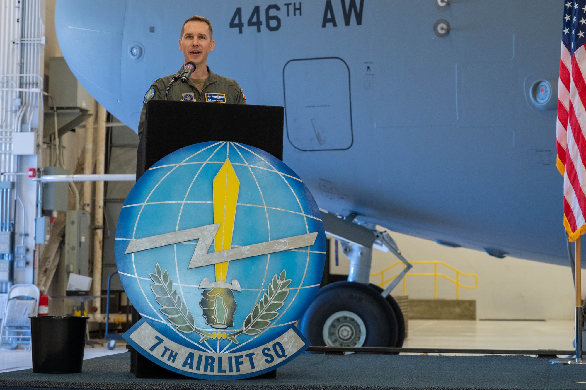 A man speaks at a podium.