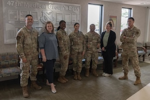 Members of the Laughlin Operational Medical Readiness Squadron (LOMRS) mental health flight come together for a group photo at Laughlin Air Force Base, Texas, May 21, 2026. The LOMRS mental health flight assists Airmen in coping with their mental stressors to fortify resilience. (U.S. Air Force photo by Airman 1st Class Darryl Keith)