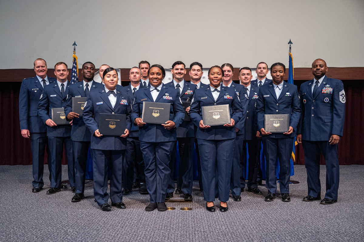 Community College of the Air Force graduates and leaders pose for a photo on their graduation day at Gunter Annex, Alabama, May 28, 2026.